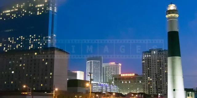 Night view of the Absecon lighthouse and casinos in Atlantic City