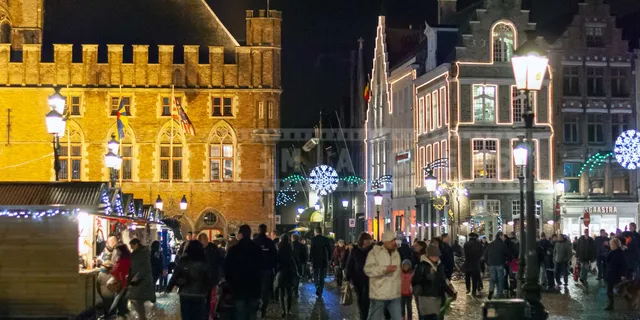 Medieval building and street vendors in the Market square