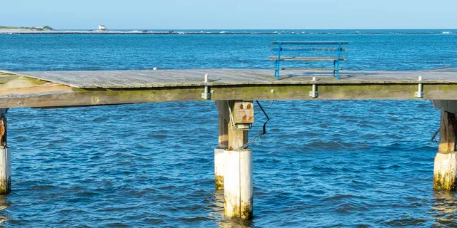 Remnants of the boardwalk with a bench in Atlantic City