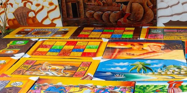 bright and colorful paintings at Dominican beach market