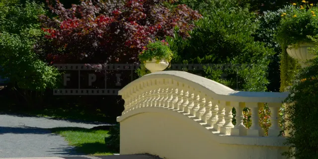 yellow stone bridge with flower vases