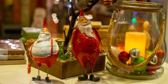 Retro style Santa's figurines in the window display