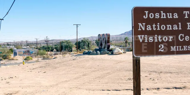 Road sign to Joshua national park and oasis of mara
