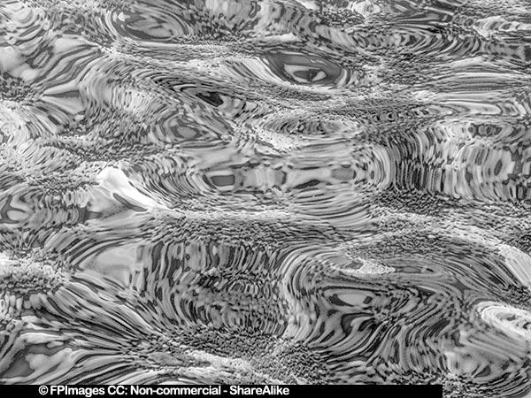 Gravel sea bottom distorted by sea surface in the Ligurian Sea