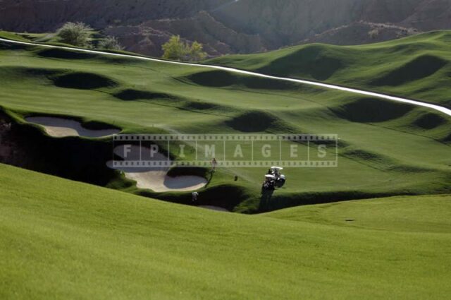 Player Looking for a Ball in a Deep Bunker, hole #14