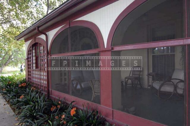 Red and white building and inviting veranda