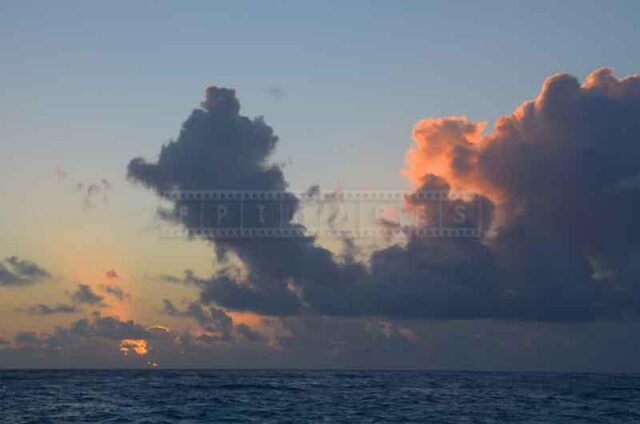 light blue sky and dark clouds