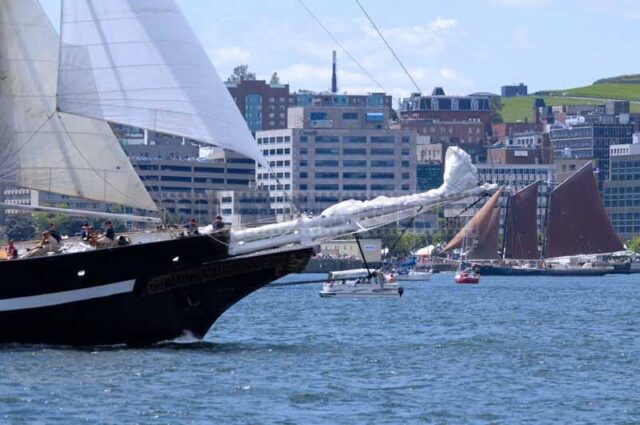 Capitan Miranda bow and red sails of Schooner Roseway, Tall ships Halifax 2009