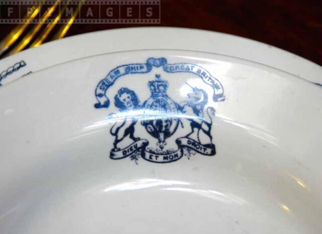 Blue crest on tableware