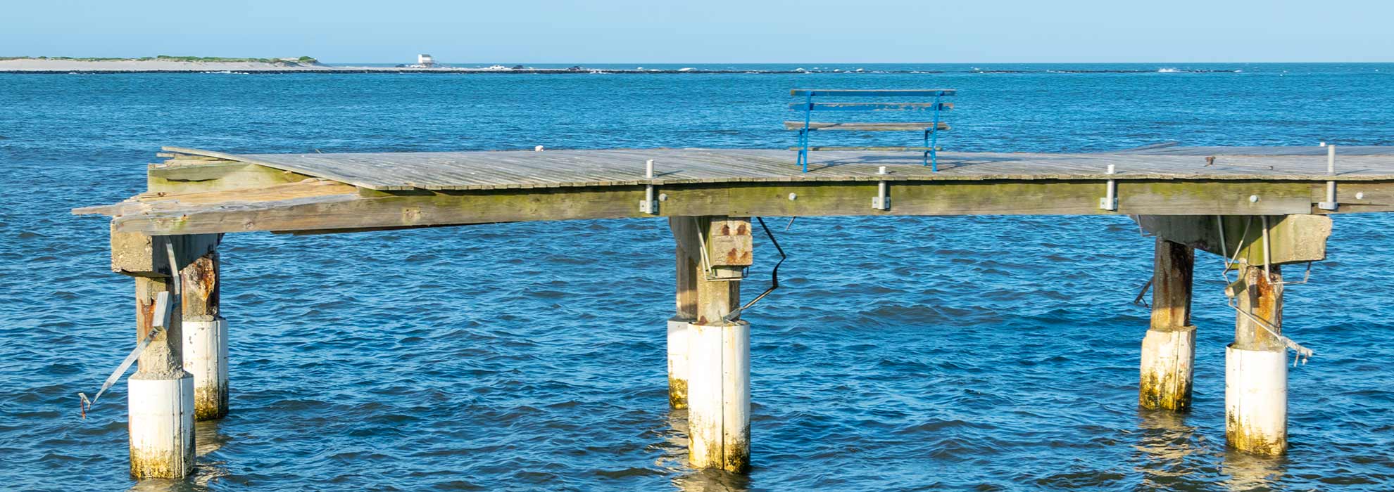 Remnants of the boardwalk with a bench in Atlantic City