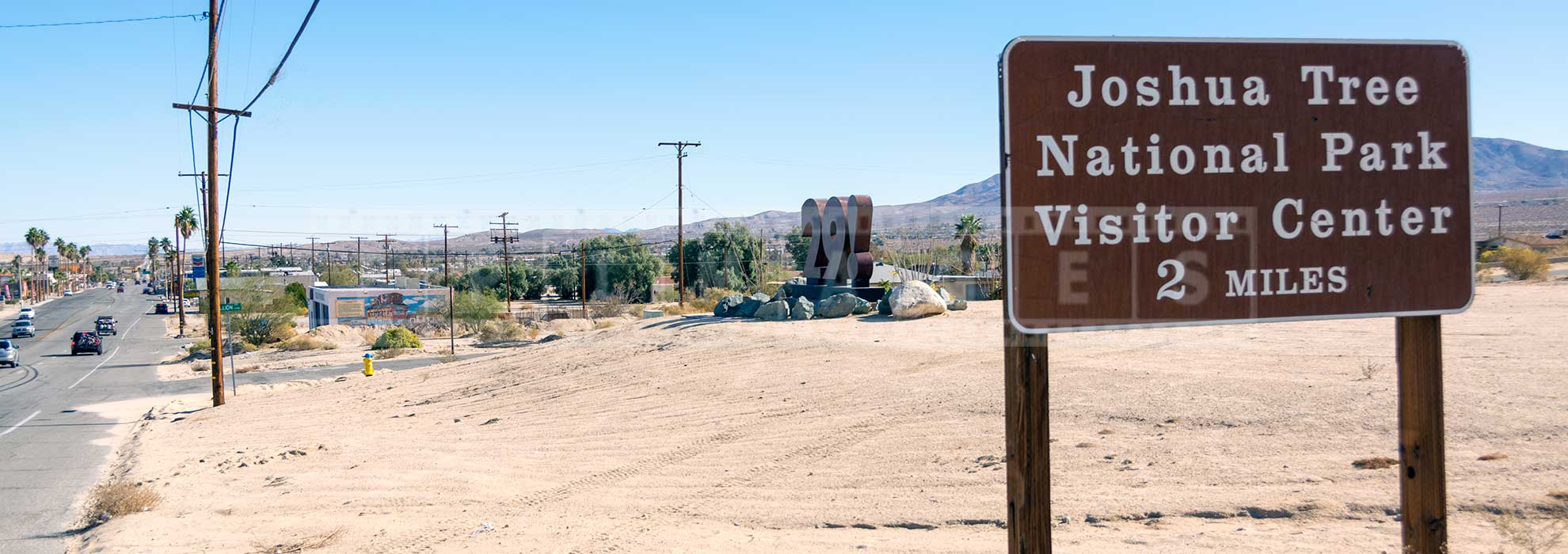 Road sign to Joshua national park and oasis of mara