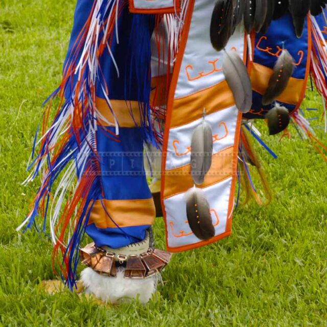 Details of dance regalia showing bright colors and native american hieroglyphs