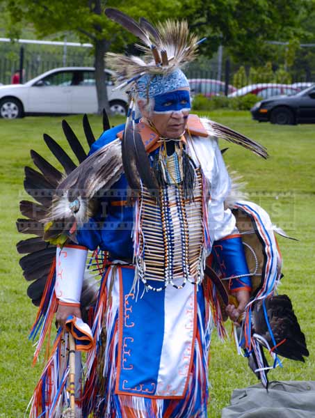 White and blue dance regalia of head dancer