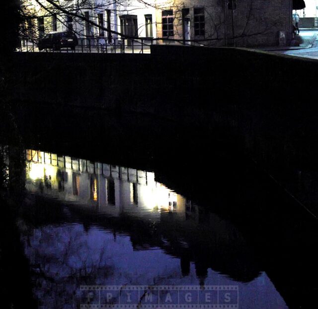 Bruges canal at night is quiet and peaceful