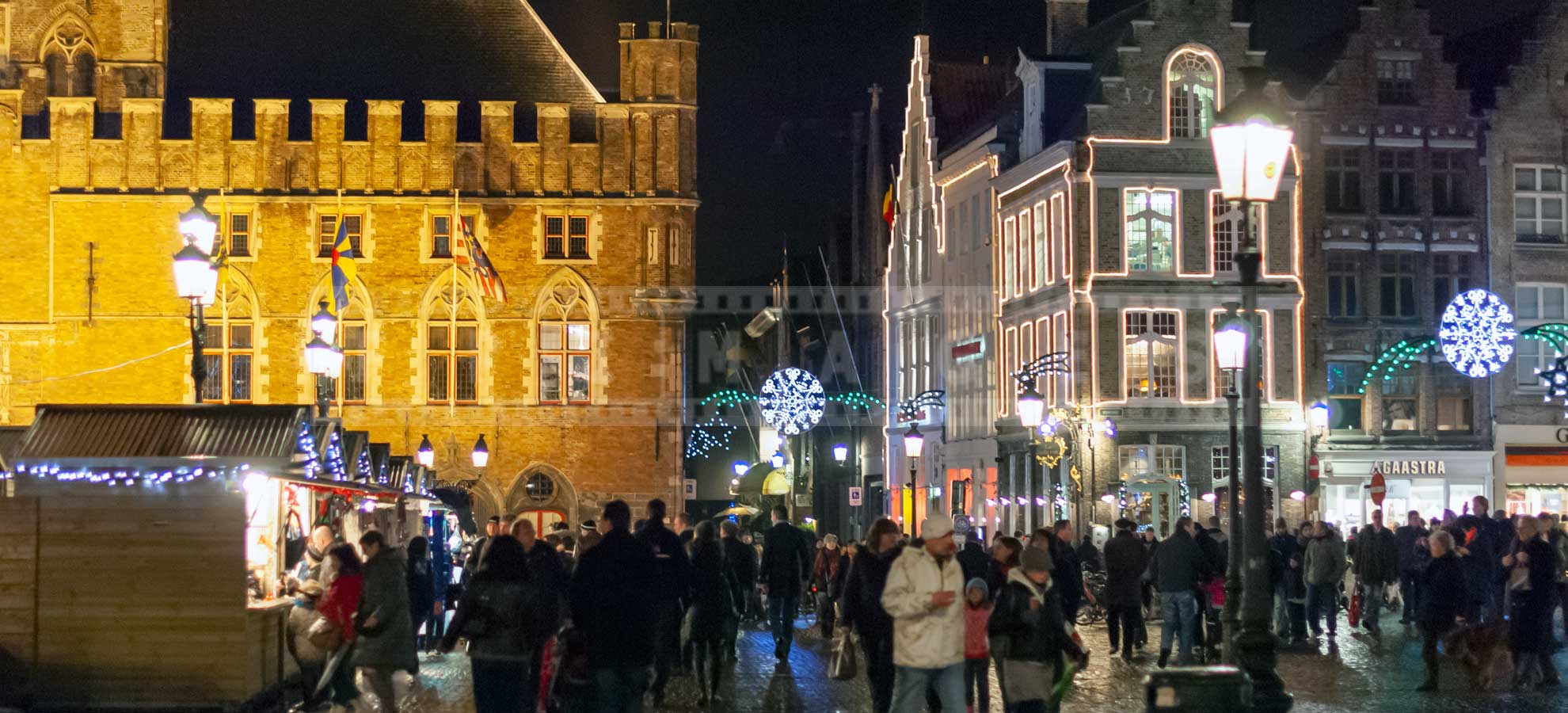 Medieval building and street vendors in the Market square