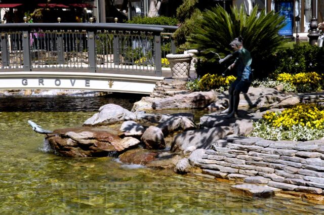 Boy fishing - statue near the pond at the Grove