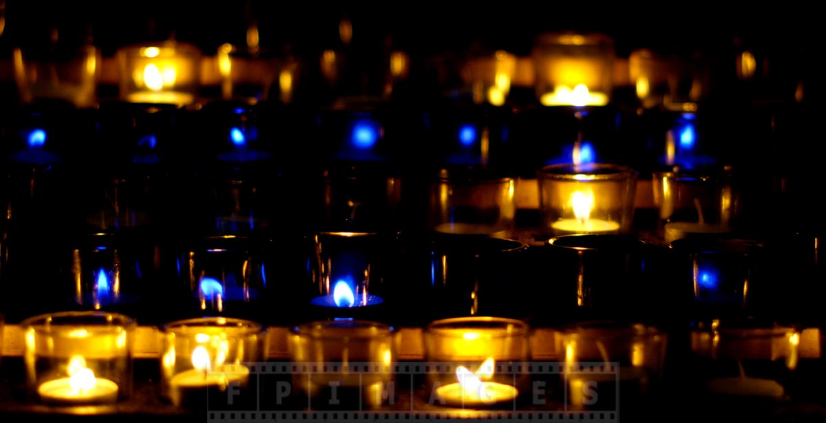 Blue and golden candles at Notre-Dame Basilica