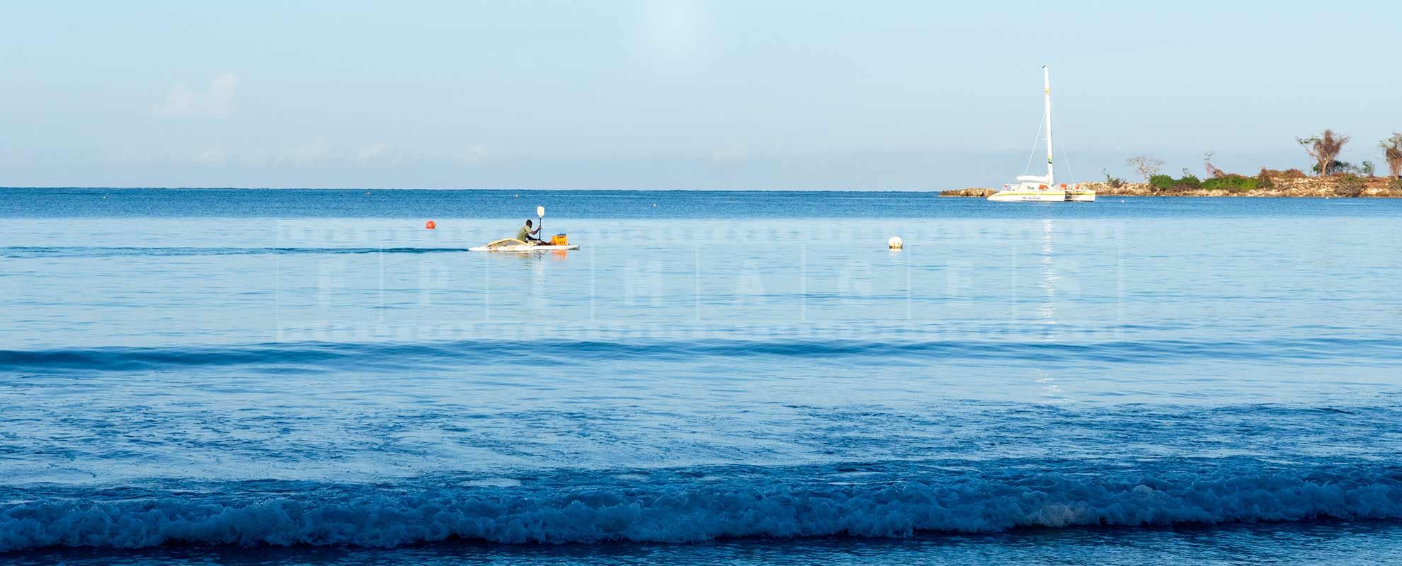 jamaica fisherman on a paddle boat