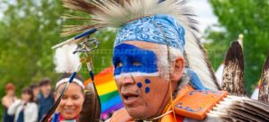 nice blue colors of face painting of a fancy dancer at pow wow