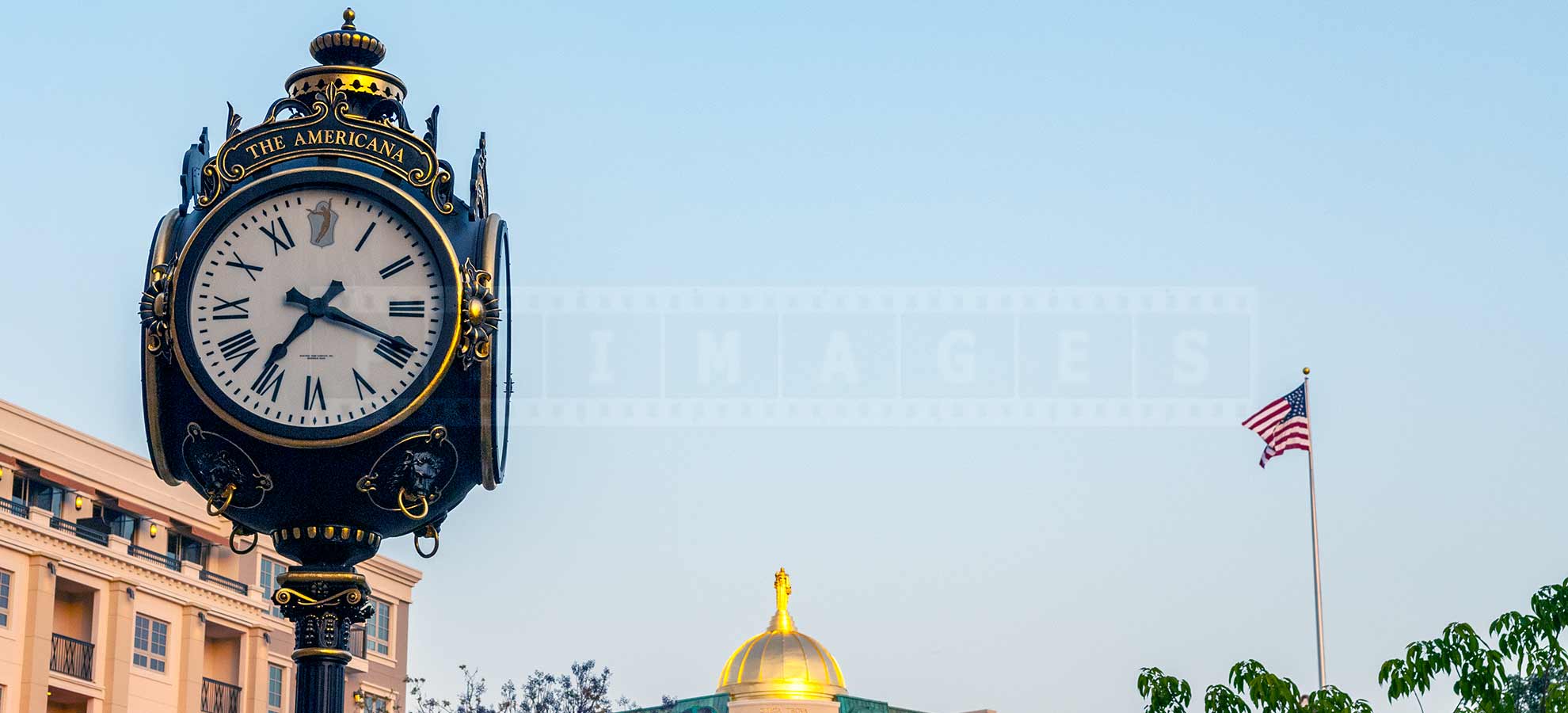 A Graceful Clock with the sign The Americana