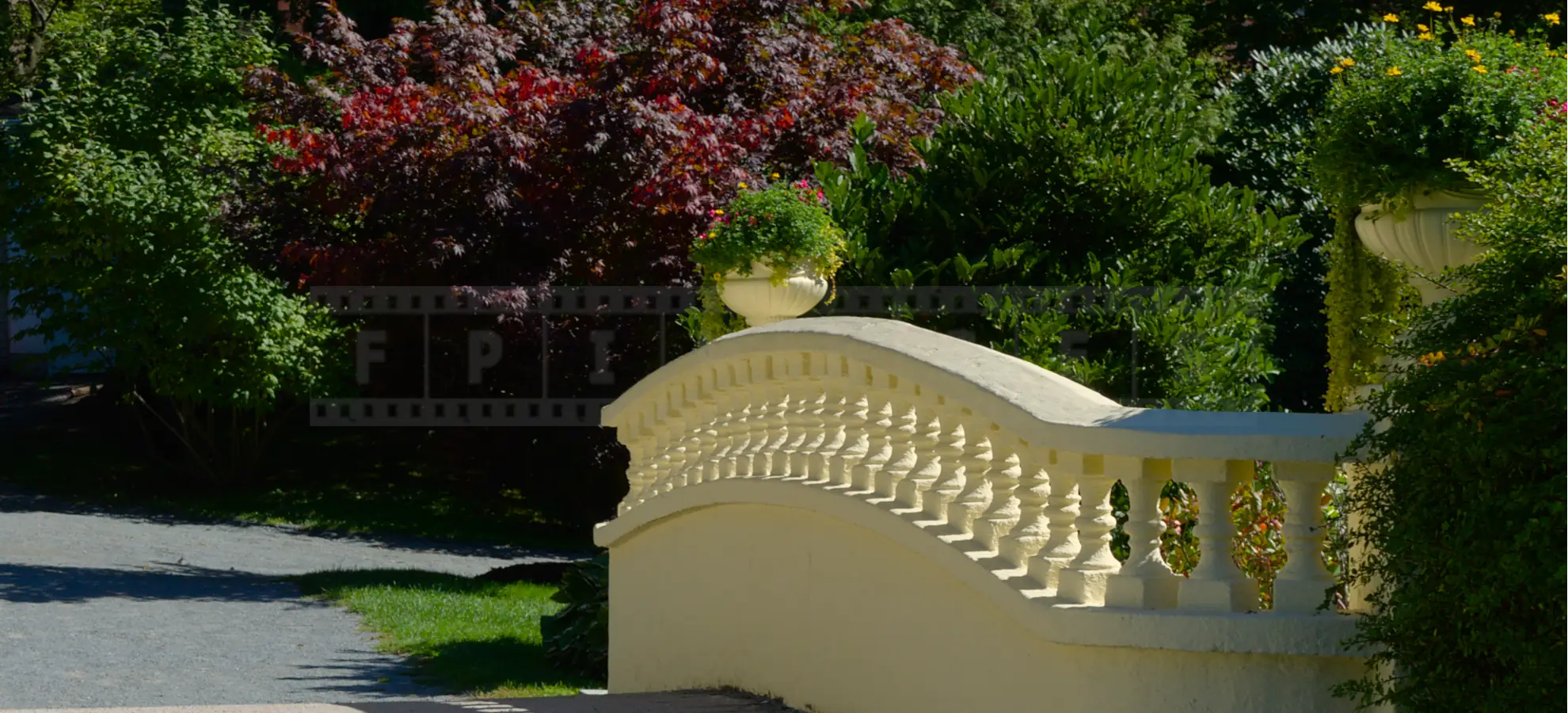 yellow stone bridge with flower vases