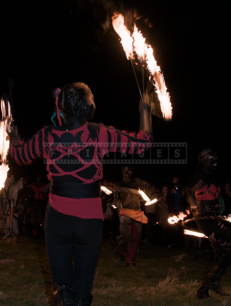 Fire dancers with fire fans at Calton Hill, Edinburgh