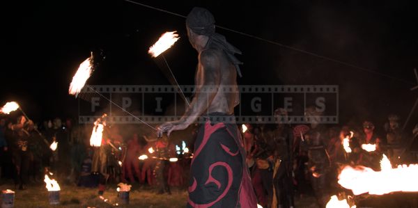 Crowd watching fire poi perfromance