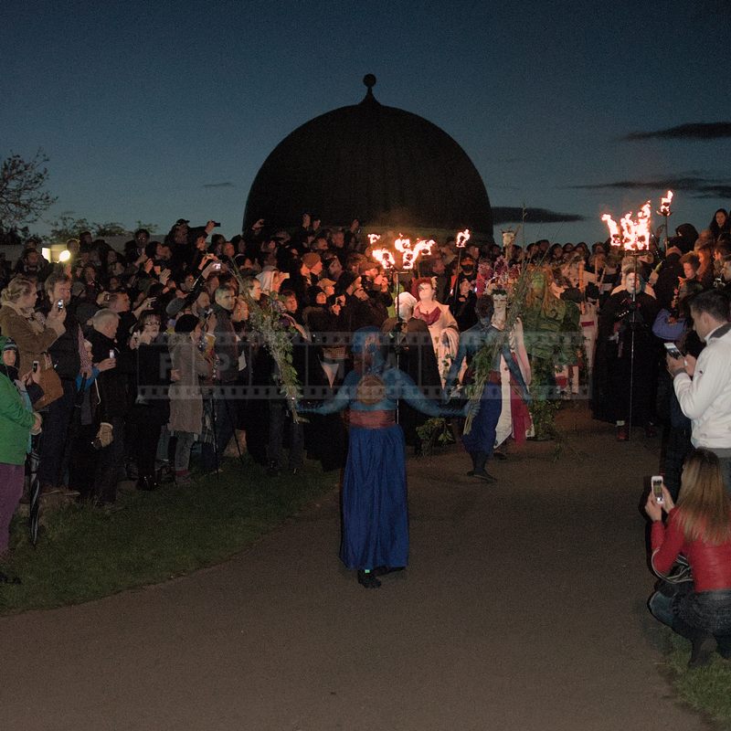 Procession of May Queen and Green man moves between the spectators