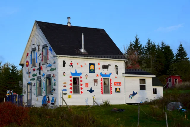 Folk artworks on display on the house in Ship Harbor, NS