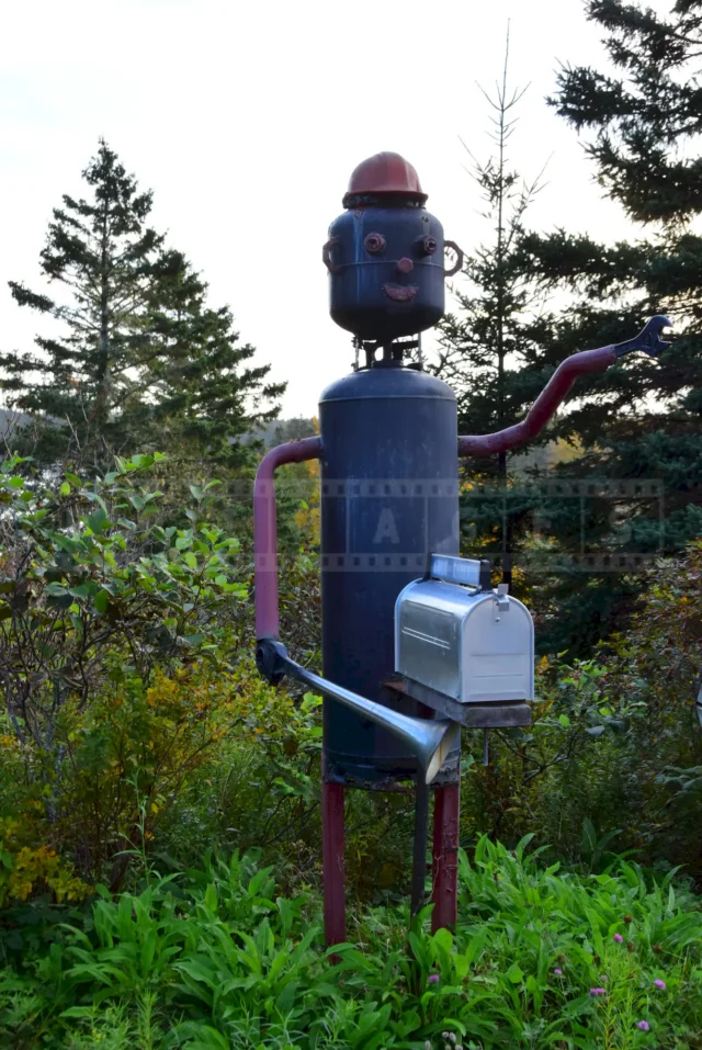 Another example of primitive art, mailbox made with used propane tanks.