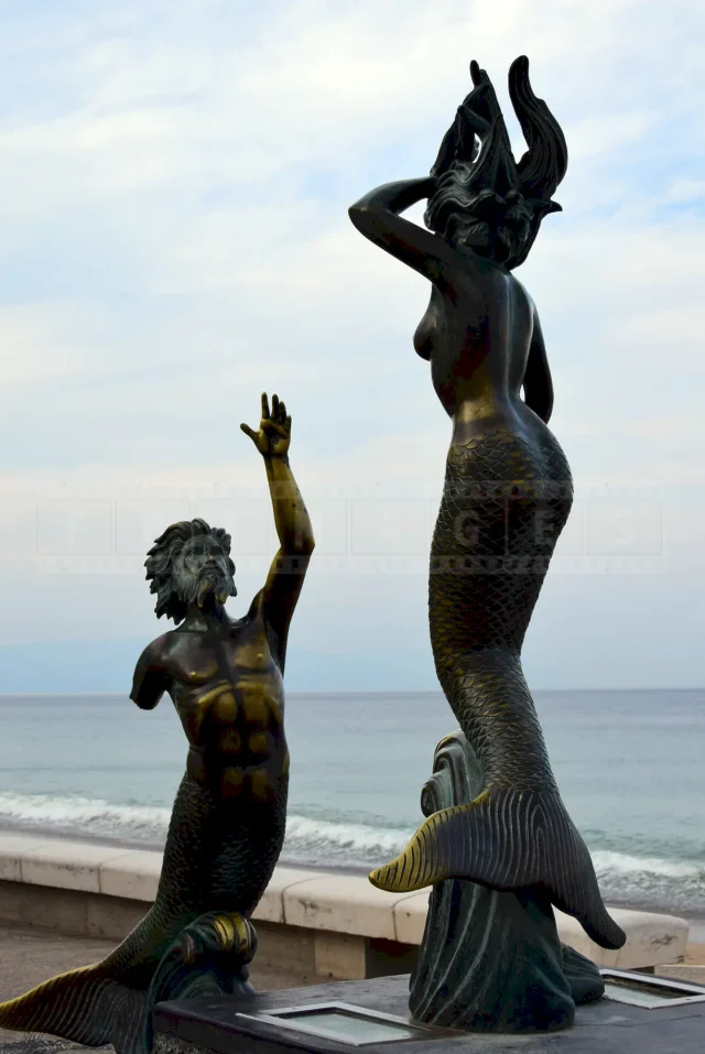 Two mermaid people
