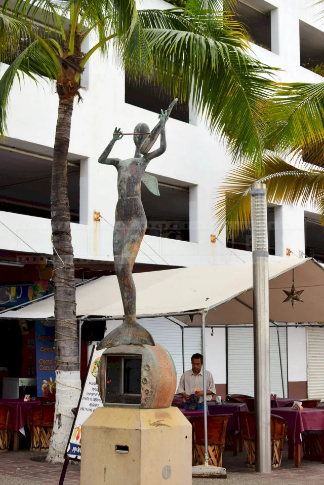 Mermaid like creature playing the violin