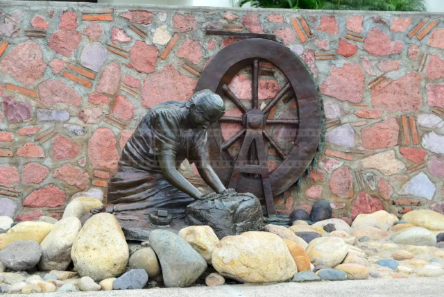 an old woman working, historical statue